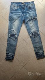 jeans amiri blu con patch blu