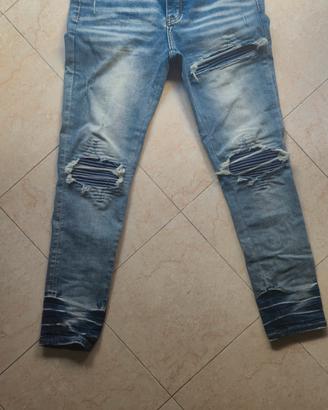 jeans amiri blu con patch blu