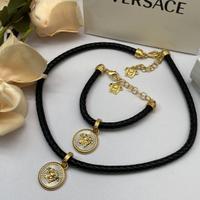 Bracciale e collana in corda intrecciata Versace