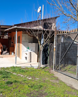 Terreno con casa