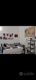 letto singolo ferro battuto,rete e materasso.