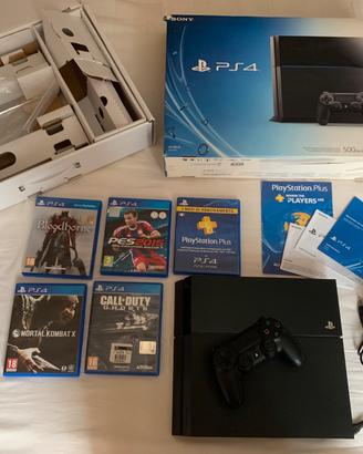 Console PS4 + 4 giochi + controller