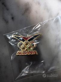 spilla Albania Olimpiadi Milano Cortina 2026