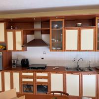 Cucina JollyComponibili ciliegio con tavolo sedie