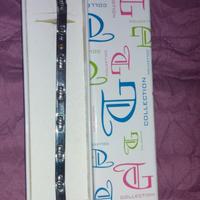 Bracciale argento con un piccolo pallino in oro.