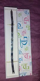 Bracciale argento con un piccolo pallino in oro.