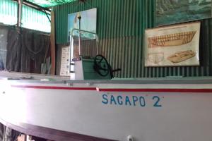 Barca open in legno con motore fuoribordo