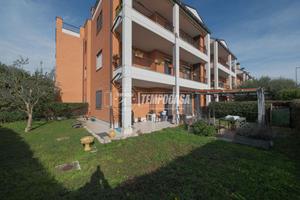 BILOCALE CON GIARDINO, CANTINA E POSTO AUTO