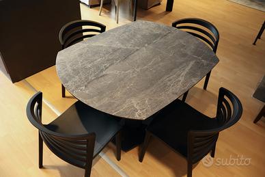 Tavolo in ceramica con basamento centrale stones