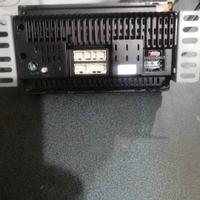 Subwoofer più amplificatore e una radio doppio din