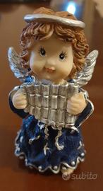 Angioletto con flauto di Pan