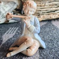 Bambino con flauto traverso 