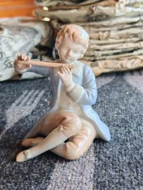 Bambino con flauto traverso 