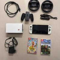 Switch OLED + 2 giochi + volanti + sd 128gb