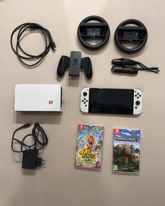 Switch OLED + 2 giochi + volanti + sd 128gb