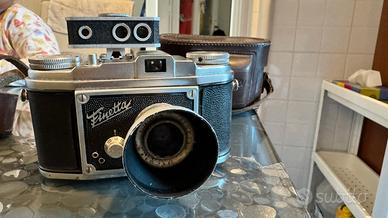 Fotocamera finetta con cistodia per parti ricambio