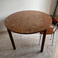 Tavolo rotondo da cucina apribile con allunghe.