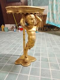 Putto angoliera  in  ebano finitura foglia oro 