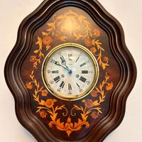 Orologio in legno intarsiato 