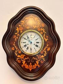 Orologio in legno intarsiato 