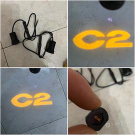 Proiettori portiera logo C2 citroen
