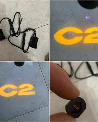 Proiettori portiera logo C2 citroen