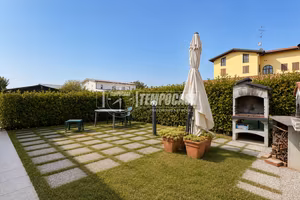 Bilocale con giardino privato in contesto riqualif