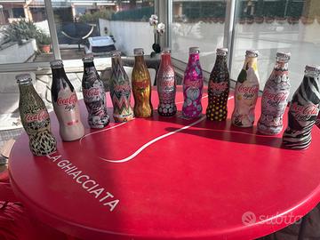 Bottiglie Coca Cola Light tributo agli stilisti