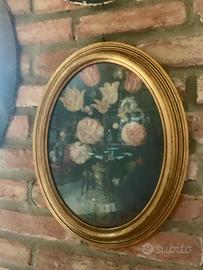 Quadro ovale floreale con cornice dorata