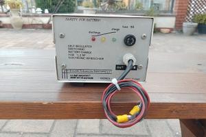 alimentatore carica batterie