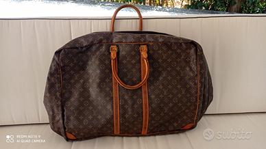 valigia Louise Vuitton