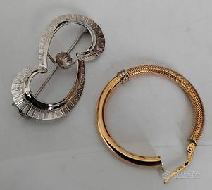 Orecchino e spilla in oro 750 