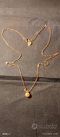 collana a in argento,con ciondolo in oro