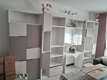 Parete attrezzata e tavolo richiudibile da 12 post