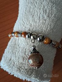 bracciale  AIRONE   acciaio e perle in ceramica  