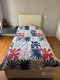 Letto in ecopelle con cassettone