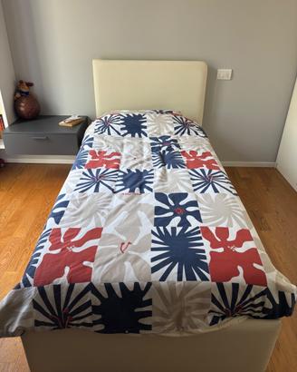 Letto in ecopelle con cassettone