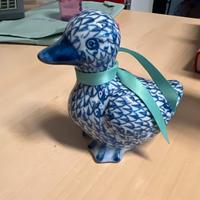 Statuina a fiorma di anatra in porcellana