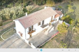 porzione casa con ,taverna ,giardino, terreno