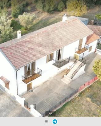 porzione casa con ,taverna ,giardino, terreno