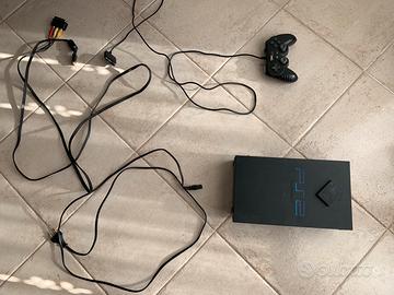 PlayStation 2 con vari giochi