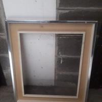 Cornice in legno argentato