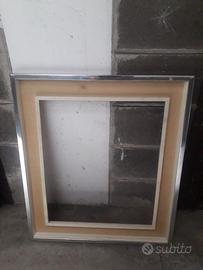 Cornice in legno argentato