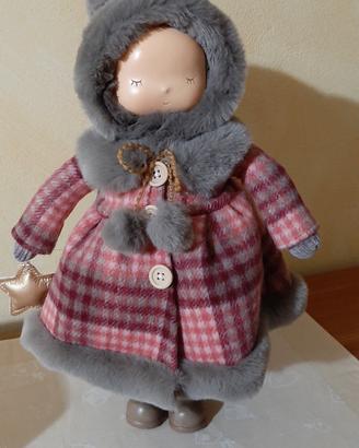 Bambola con cappottino