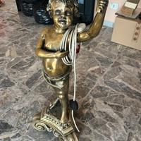 Putto grande con candelabro