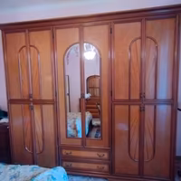 Armadio a sei ante in legno massello