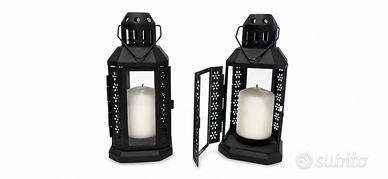 Lanterne decorative in metallo e vetro con candele