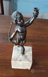 Angelo cherubino, Putto in bronzo primi '900