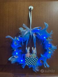 Ghirlanda pasquale luminosa con coniglietti