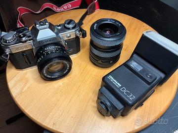 Canon AE‑1 + Canon FD 50mm f/1.8 + Tamron 28–70mm